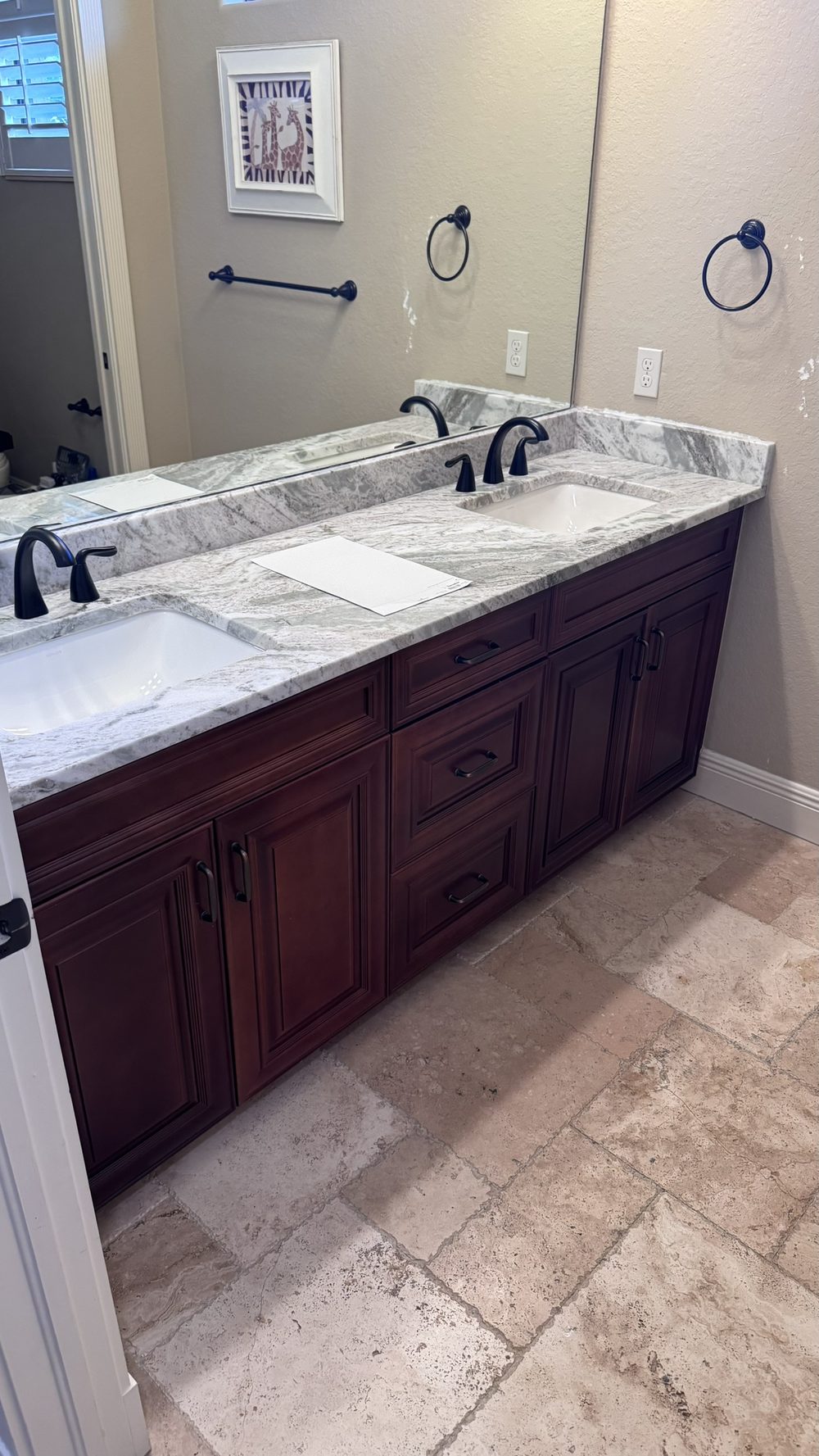 Bathroom vanity before cabinet painting in Cape Coral — dark cherry wood cabinets