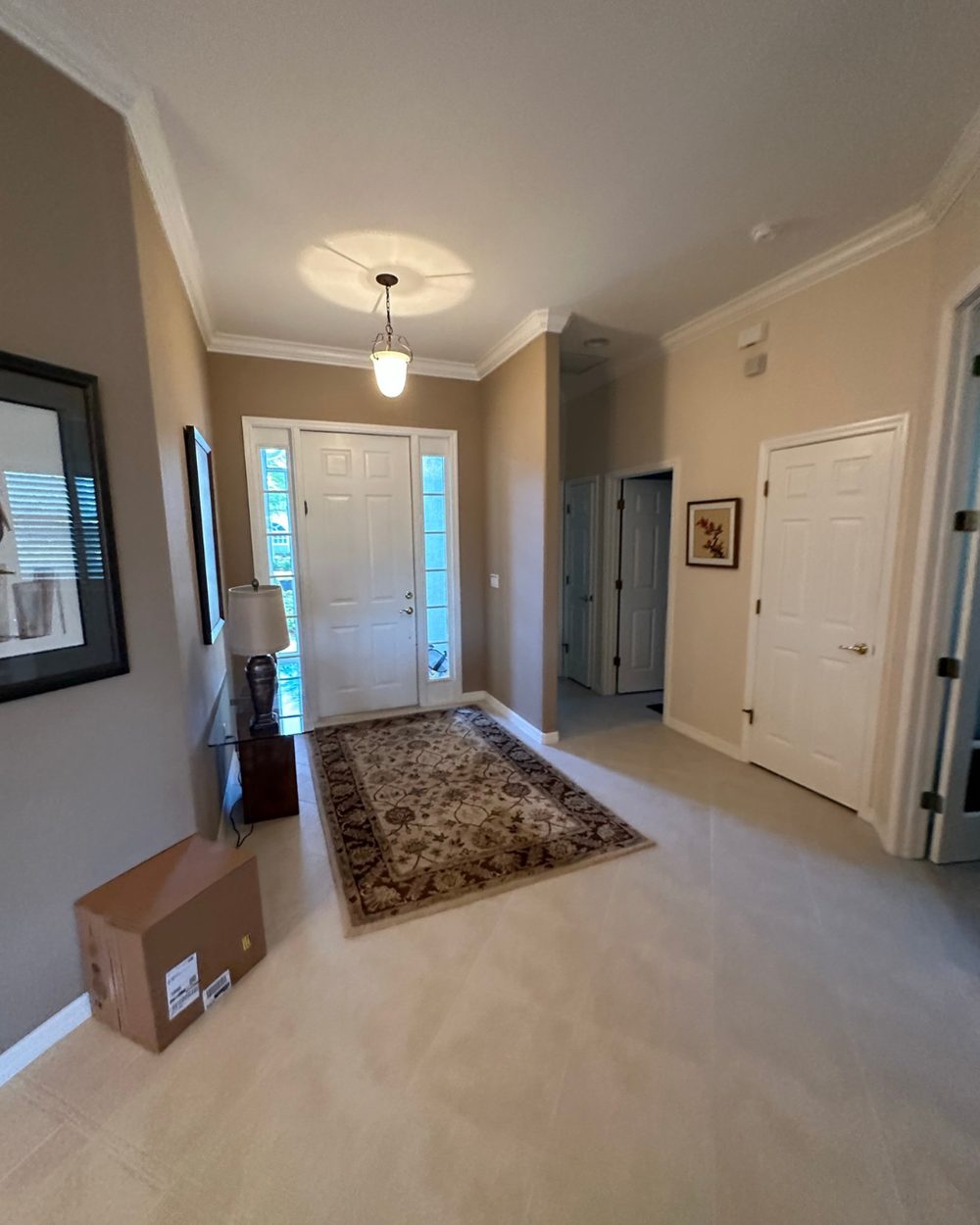 Entryway before painting — plain beige walls