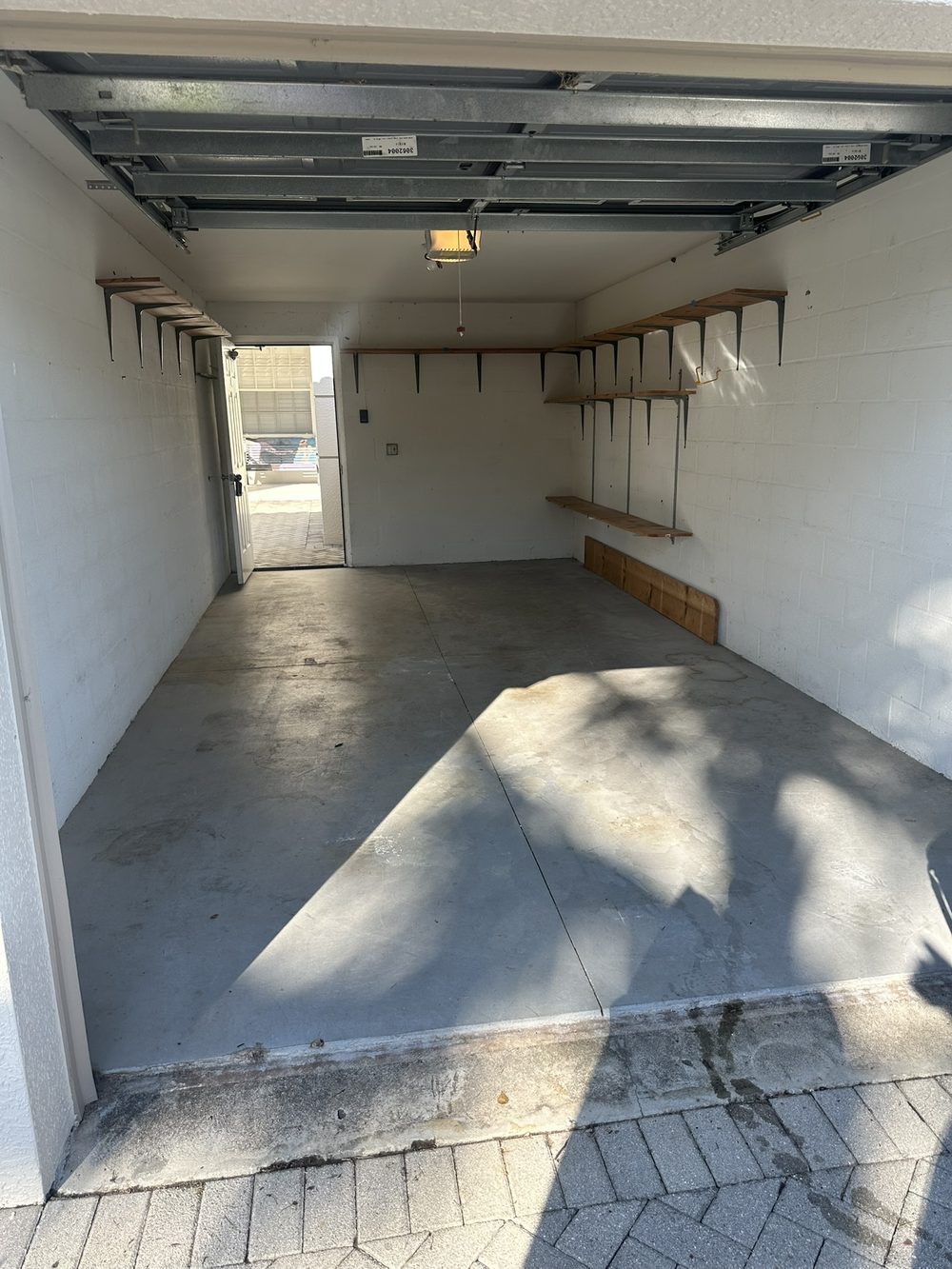 Garage floor before epoxy coating in Cape Coral — bare gray concrete