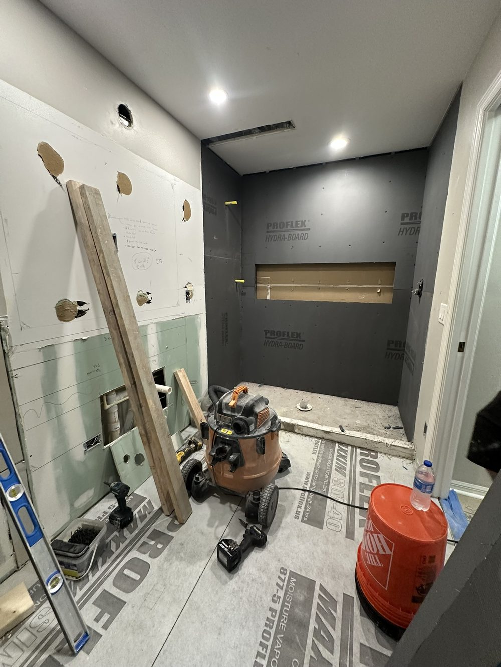 Shower before remodel — mid-construction with Proflex Hydra-Board waterproofing panels